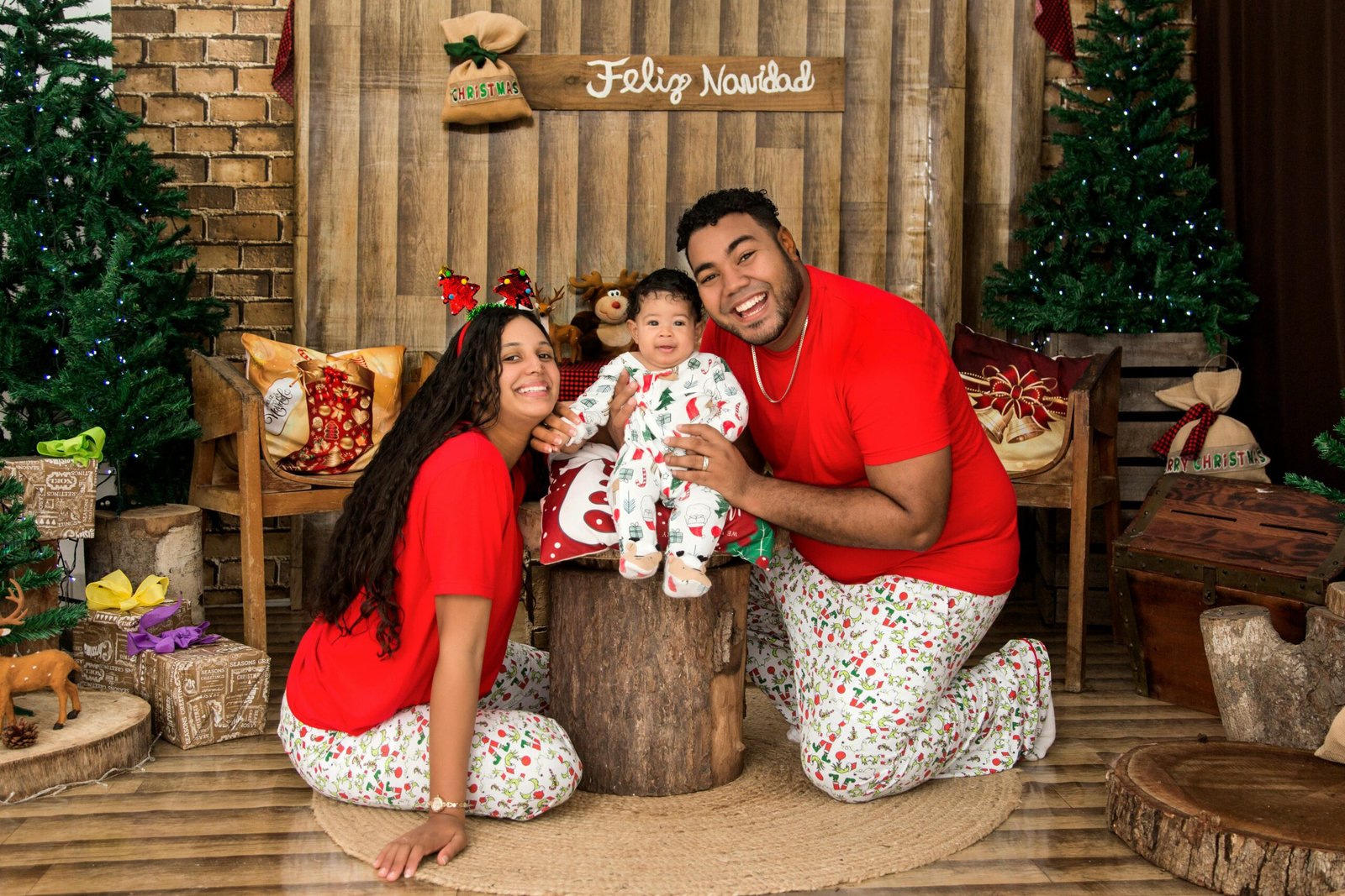 Happy family in festive attire celebrating Christmas at home, Puerto Plata.